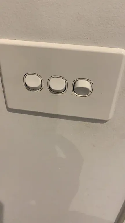 Bathroom after cleaning - pristine tiles and sparkling fixtures