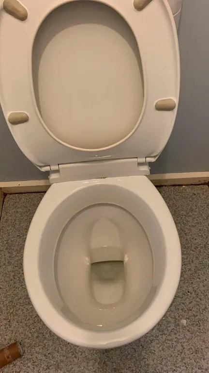 Bathroom after cleaning - pristine tiles and sparkling fixtures