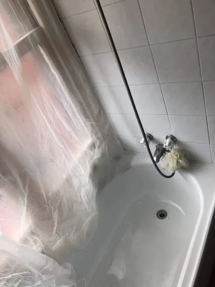 Bathroom after cleaning - pristine tiles and sparkling fixtures