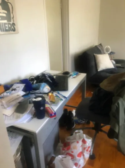 Office space before cleaning - messy desk and floors