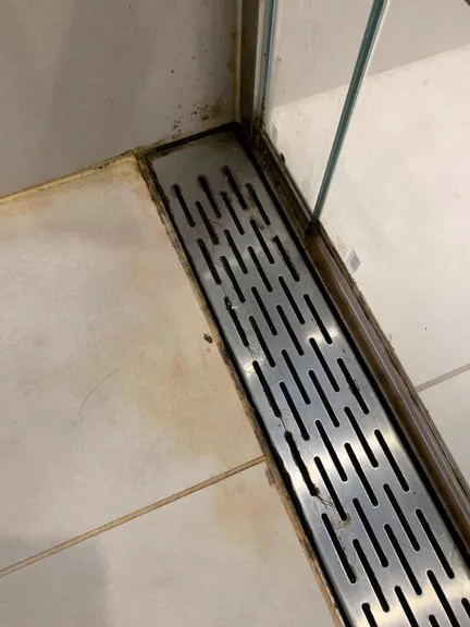 Bedroom before cleaning - cluttered and dusty surfaces